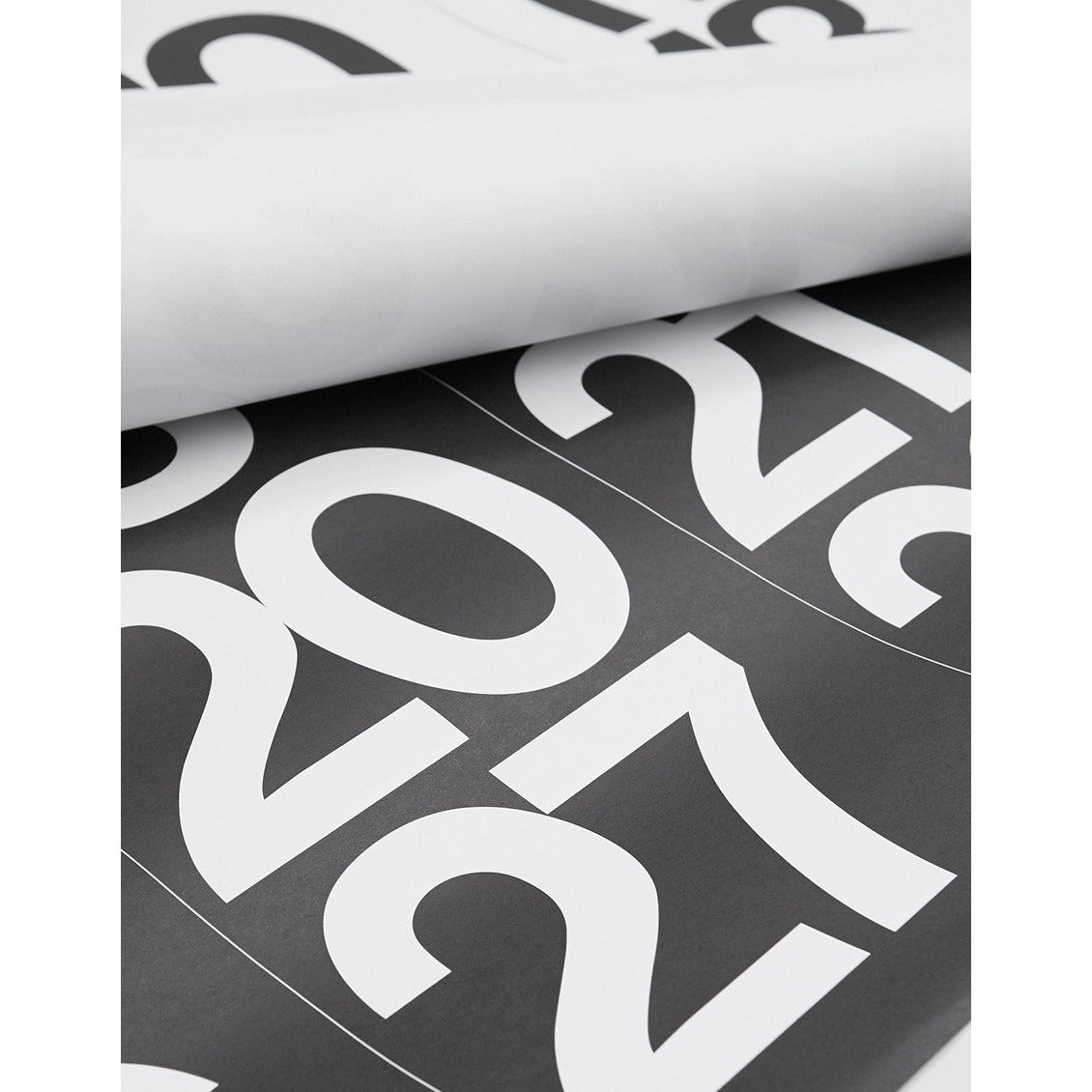 Rolled Stendig wall calendar showing the oversized white numerals on black