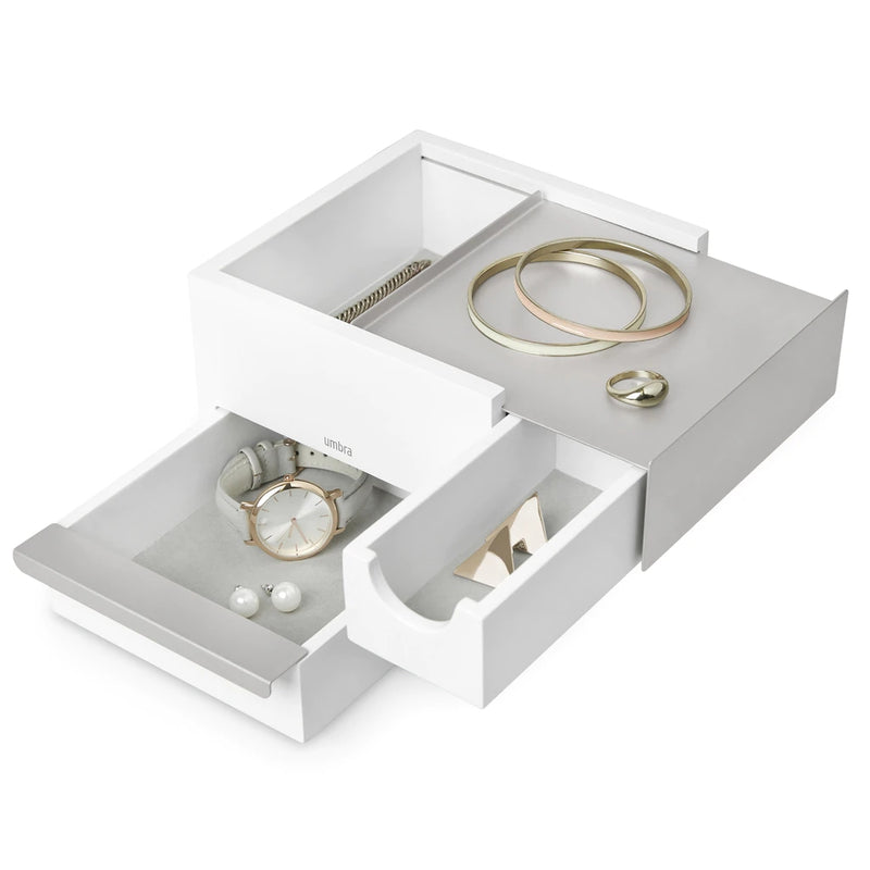 A Umbra STOWIT MINI JEWELRY BOX WHT/NKL with hidden compartments for organizing jewelry.