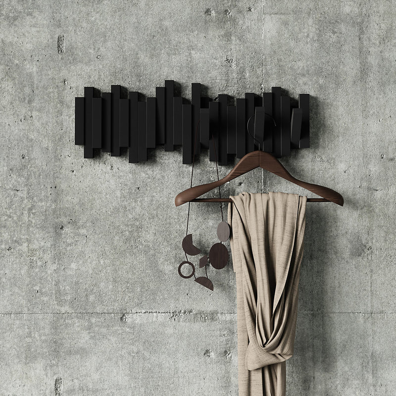 A Umbra Sticks Multi Hook - Black wall coat rack with flip-down hooks for home organization.