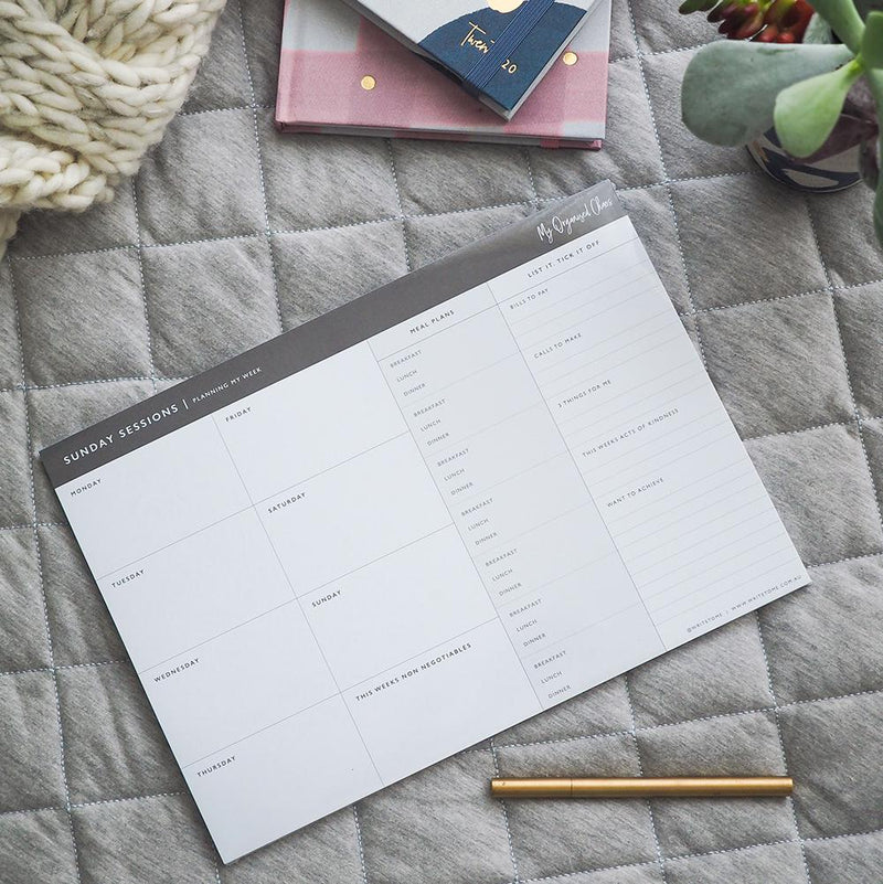 A Sunday Sessions - Planning My Week productivity planner with a notebook and pen on a bed, designed for efficient planning and organization by Write To Me.
