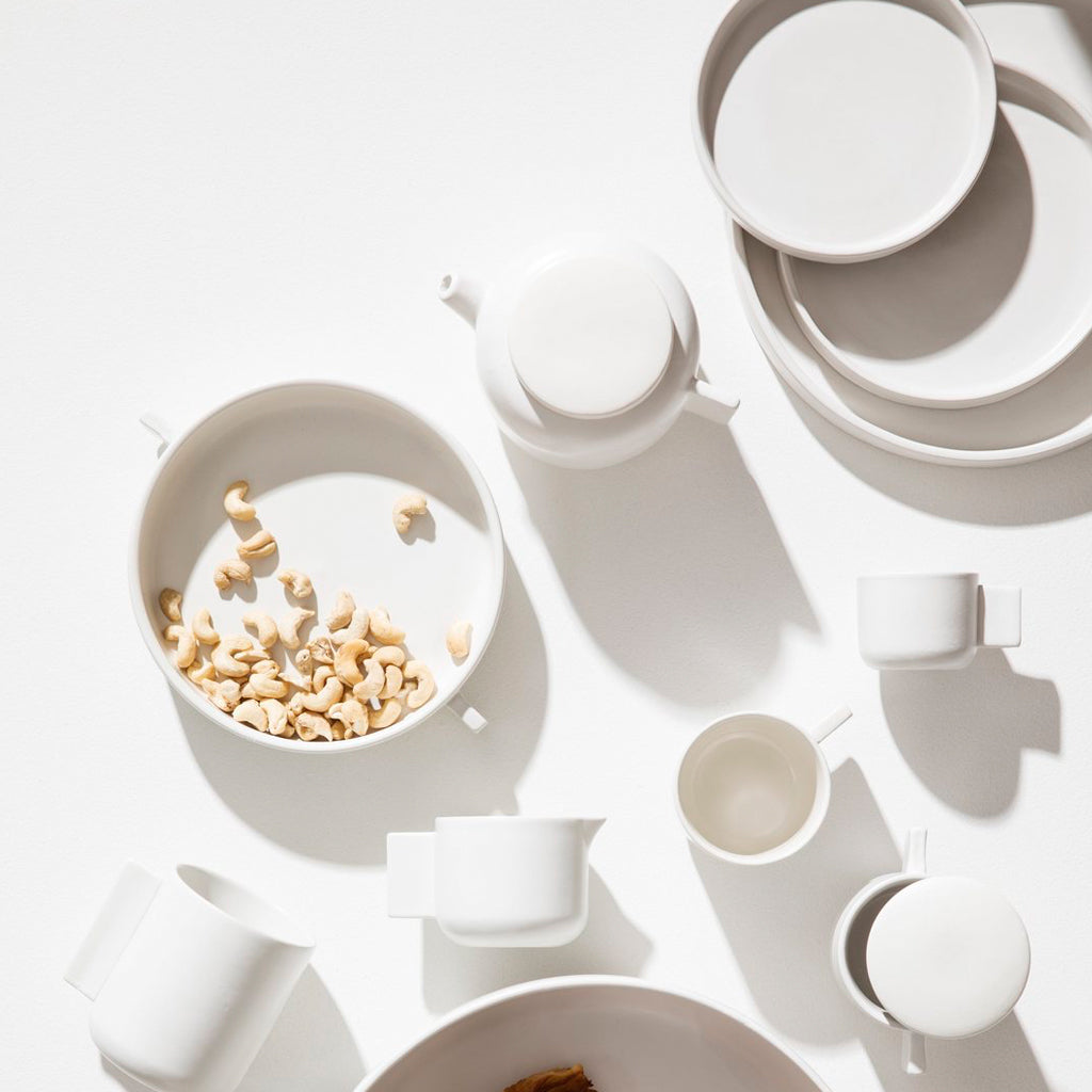 A collection of Zakkia Tab Plates - Various Sizes with a versatile design on a white surface.