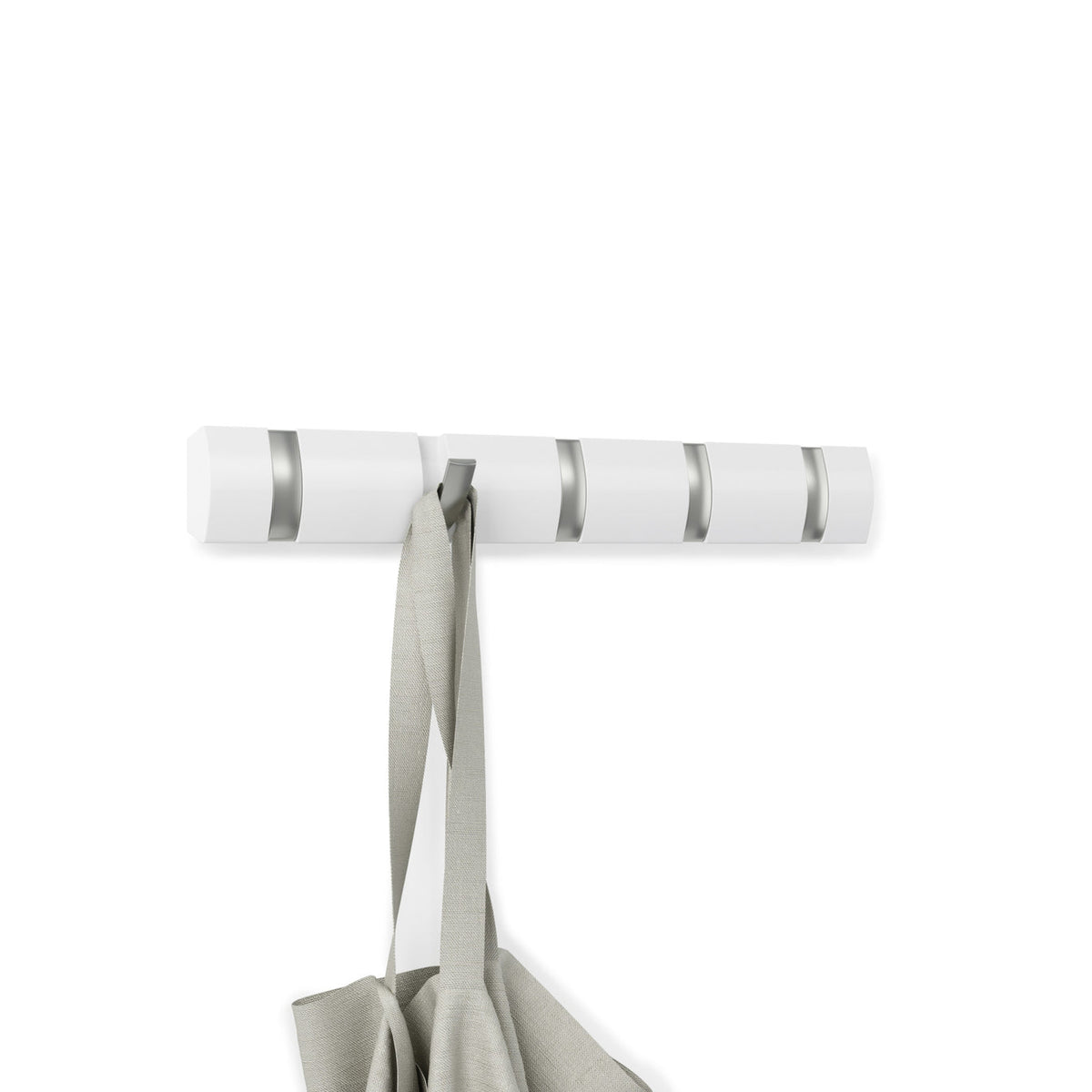 Umbra Flip 5 hook rack in white with one retractable hook down holding a tote
