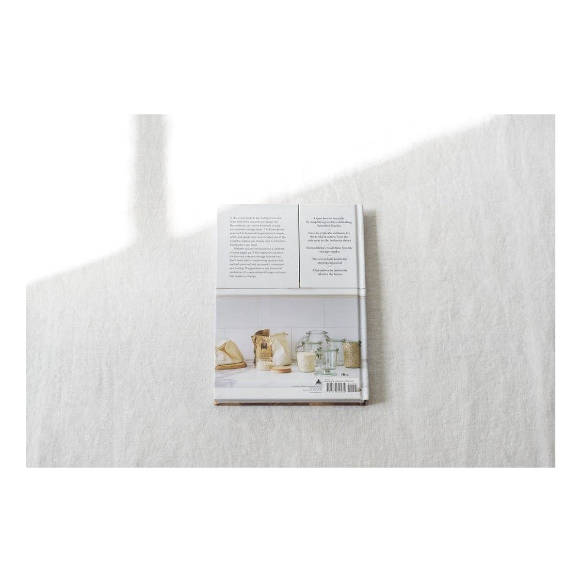 Remodelista The Organised Home book page spread showing a closet