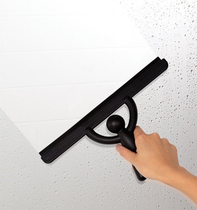 Umbra Buddy Squeegee in black shown from the side, a compact silicone shower squeegee with anti rust body