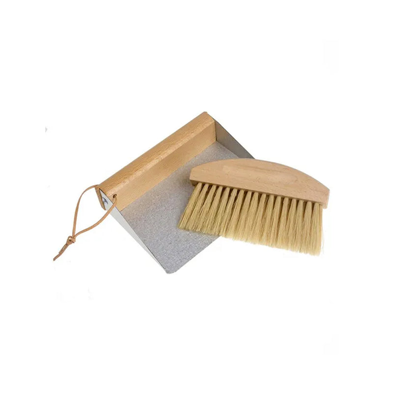 A Florence TABLE DUST PAN & BRUSH for cleaning crumbs is placed on a wooden tray, both resting on a white background.