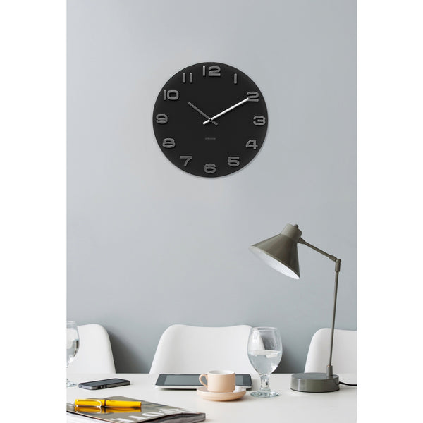 A Wall Clock - Vintage Black on a white wall by Karlsson.