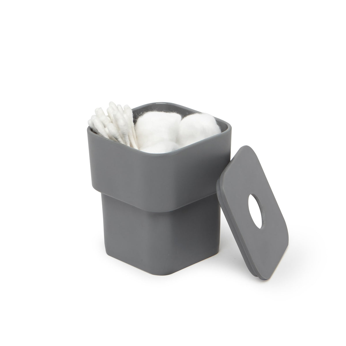Charcoal SCILLAE canister filled with cotton balls and buds, lid set beside it