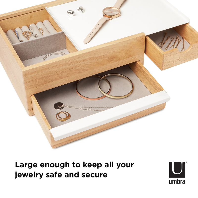 This spacious STOWIT JEWELRY BOX NATURAL by Umbra features hidden compartments and storage drawers, providing ample space to keep all your jewelry safe and secure.