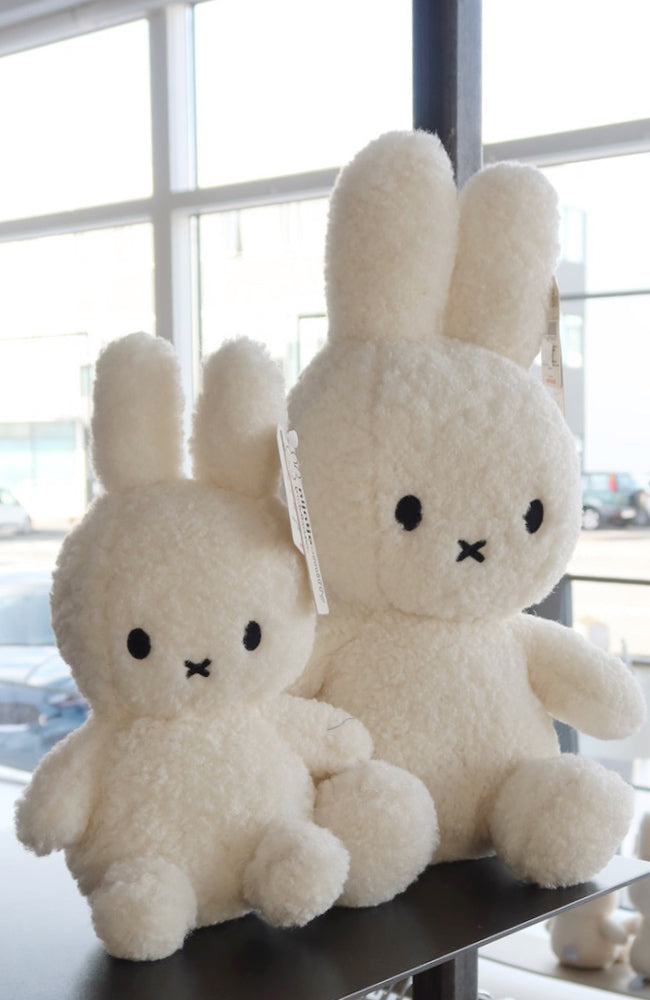 Two Miffy Sitting Teddy Cream (33cm) stuffed animals from Mr Maria sitting on top of a table.