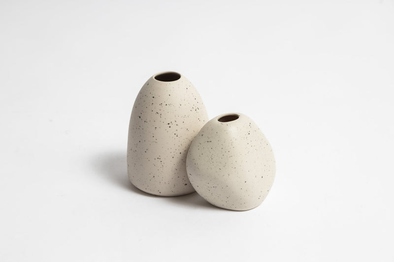 Two Harmie Vases - Seed Grey, created by Vietnamese artisans, placed on a white surface. Brand Name: Ned Collections.