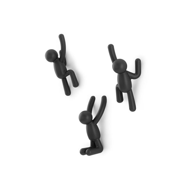 Three Buddy Hooks Black - Set of 3 hanging on a white background in an Umbra wall décor.