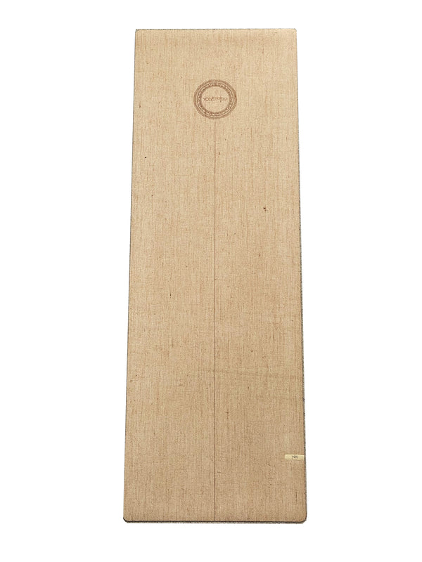 A Yogatribe logo-emblazoned wooden yoga mat.