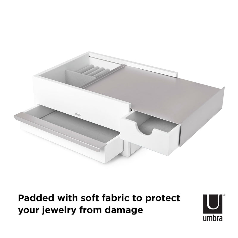An Umbra STOWIT JEWELRY BOX WHT/NKL with a soft fabric to protect your jewelry from damage.