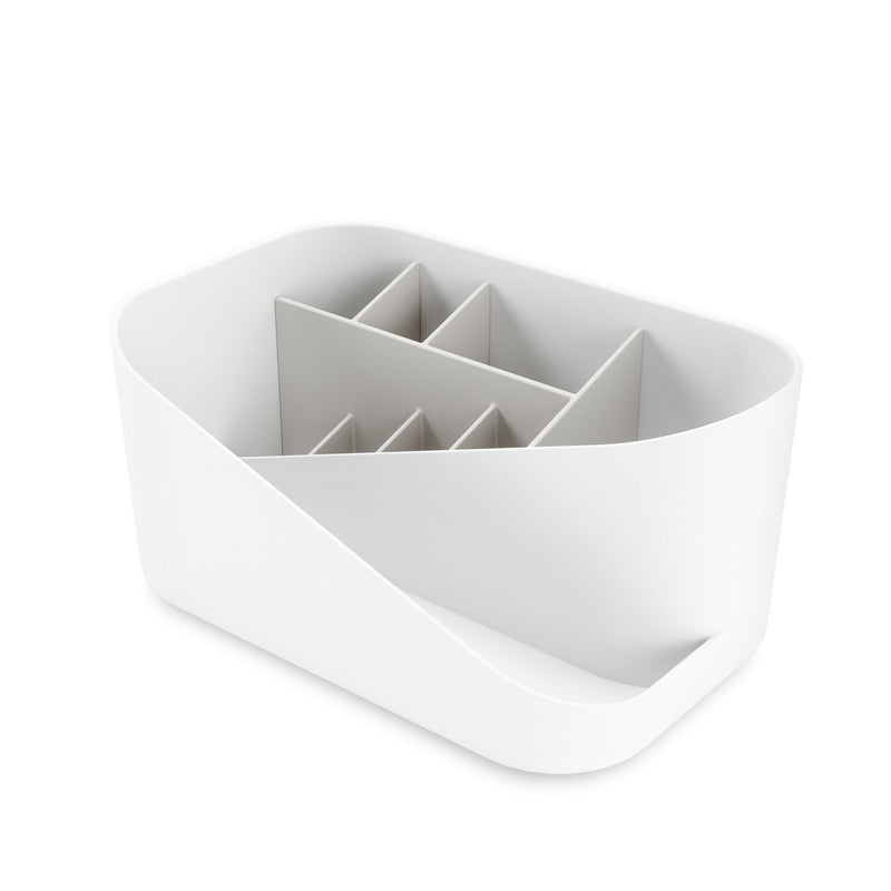 An Umbra Glam Cosmetic Organizer, featuring a white container with multiple storage compartments.